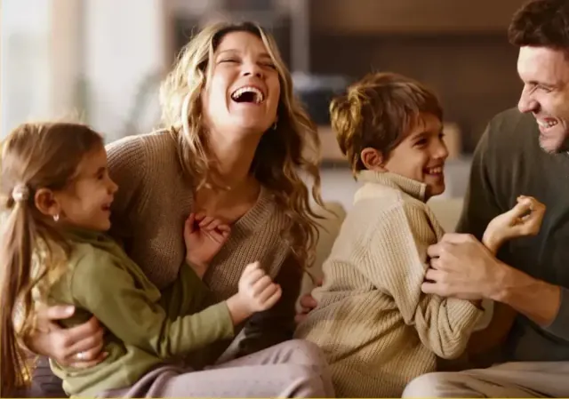 Happy family at home protected by family-friendly pest control in the San Gabriel Valley